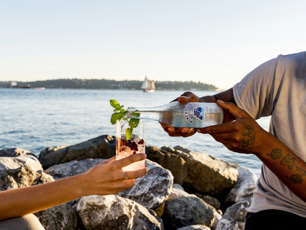 People enjoying a mocktail on the beach